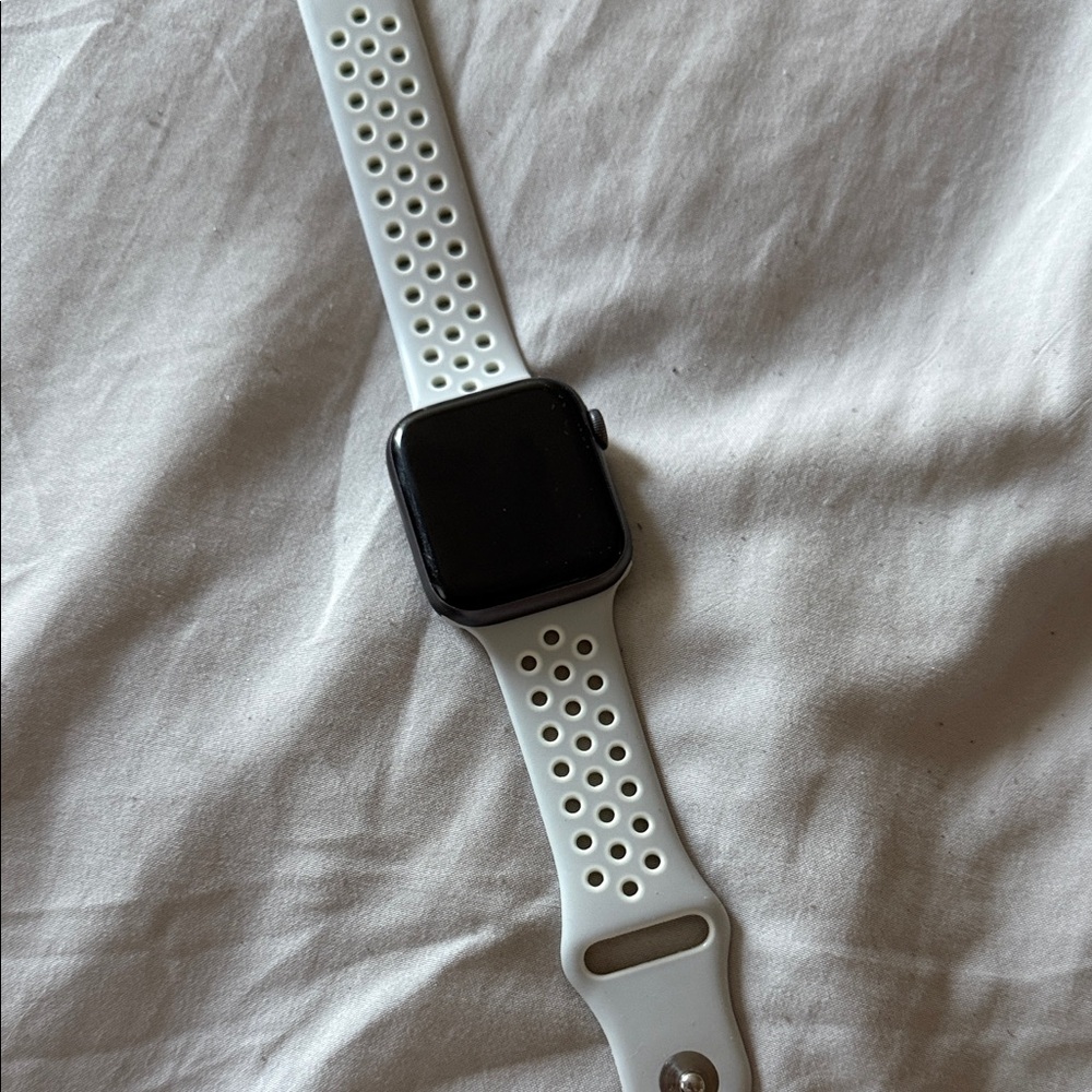 Apple Smartwatch with Black Face and White Strap